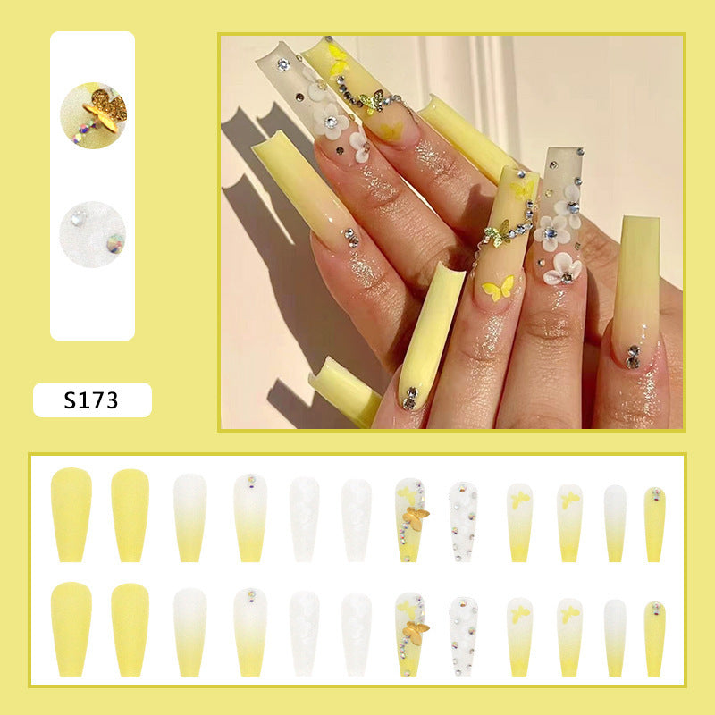 Artificial nail extensions with floral accents and rhinestones Kalsten