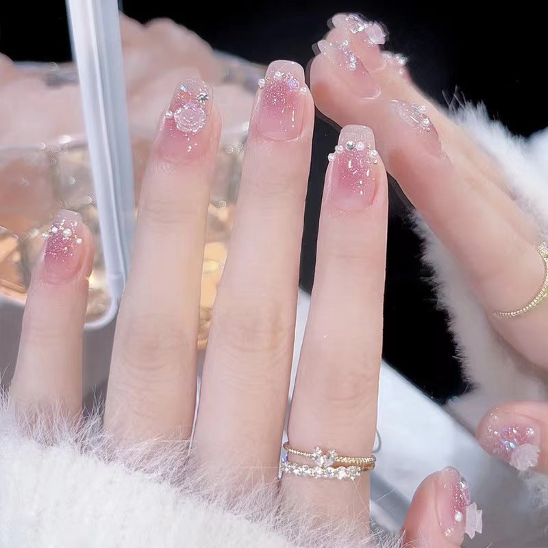 Glamorous nail art with rhinestone and pearl accents Kalsten