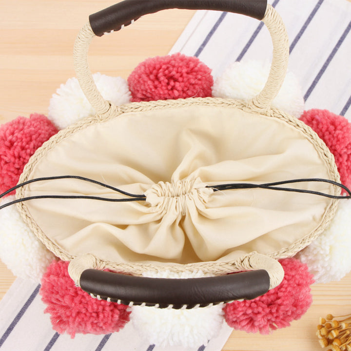 Basket bag with pompom decorated top edge Kalsten