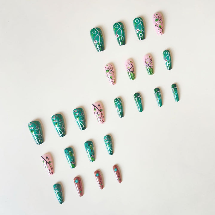 luxurious artificial nail set with floral designs and detailed accents Kalsten