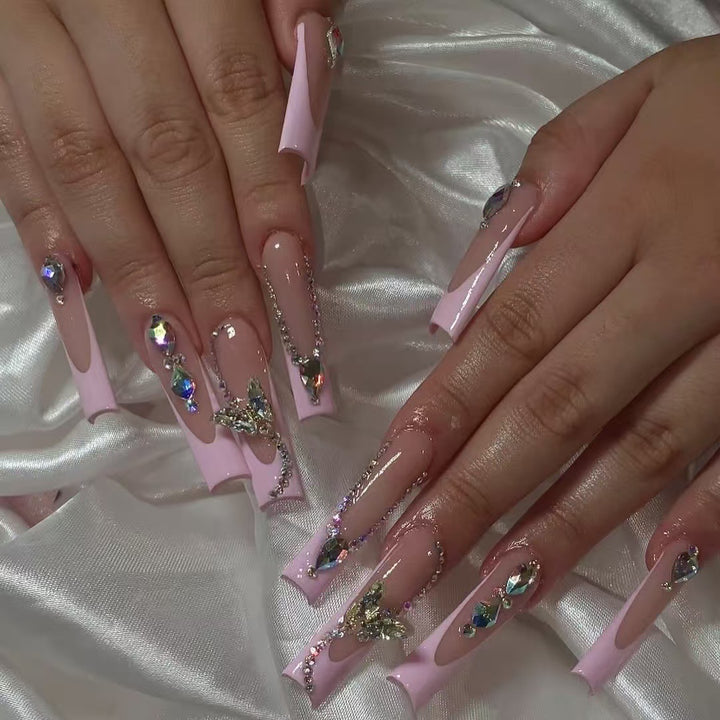 Acrylic nail set with elegant glitter and rhinestone accents Kalsten