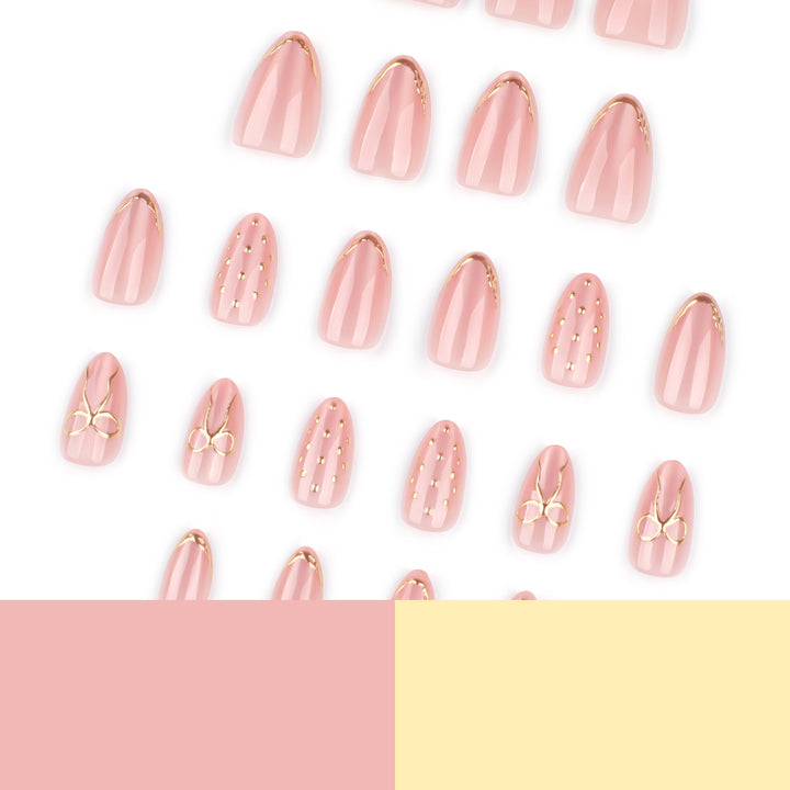 Artful nail extensions with elegant golden accents Kalsten