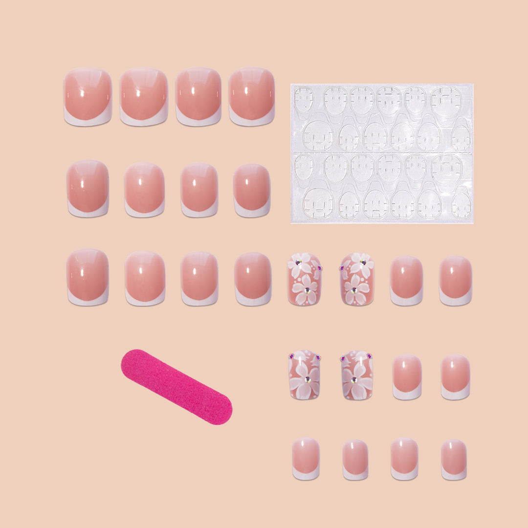 Artificial nail set with elegant French design and floral accents Kalsten