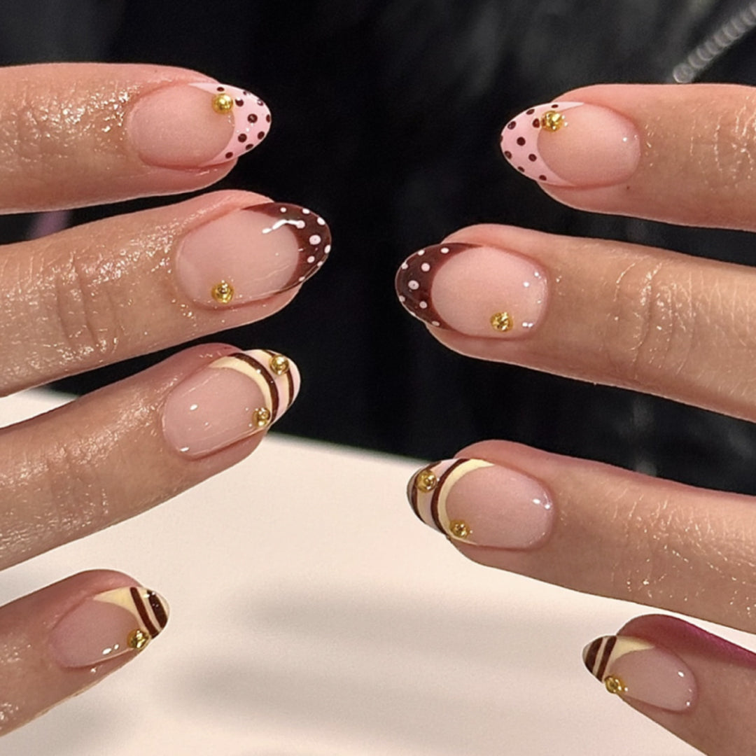 Artful stiletto nails with elegant floral design and glitter details Kalsten