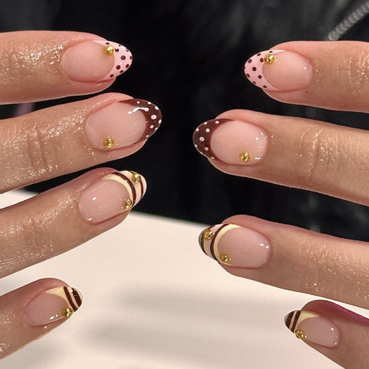 Artful stiletto nails with elegant floral design and glitter details Kalsten