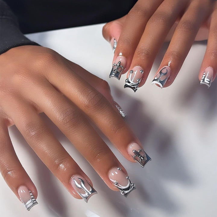 Artistic nail extensions with metallic embellishments Kalsten