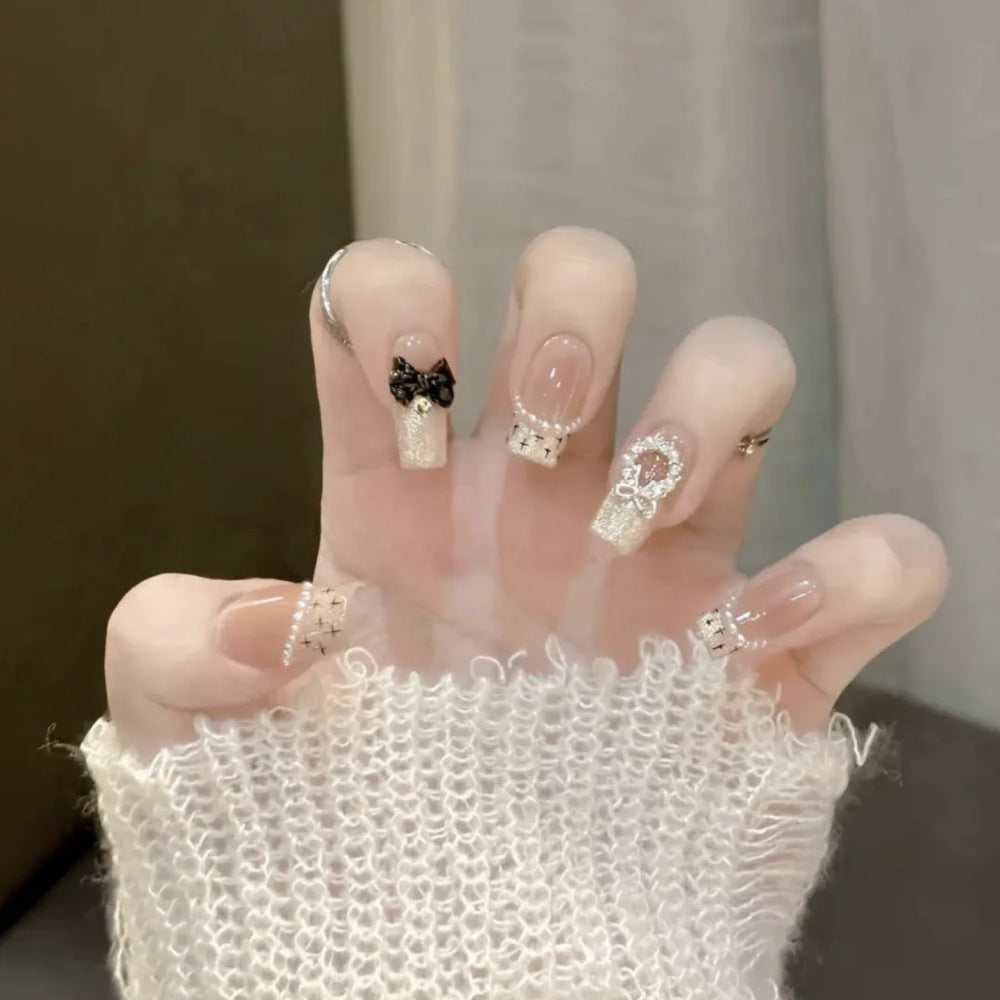 Glamorous artificial nails with sparkling decorations Kalsten