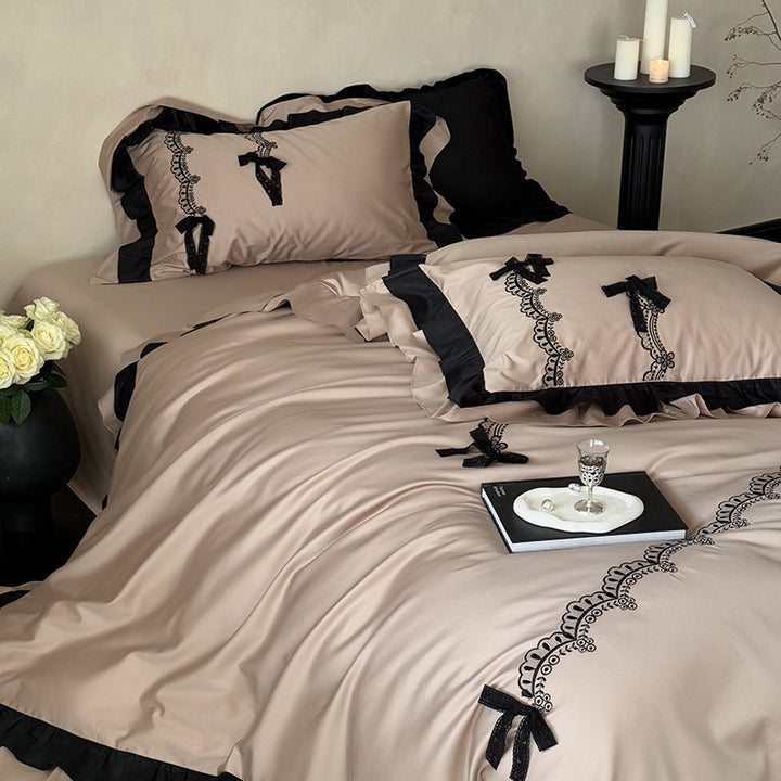 Luxurious satin bedding set with ruffles, lace embroidery and decorative bows