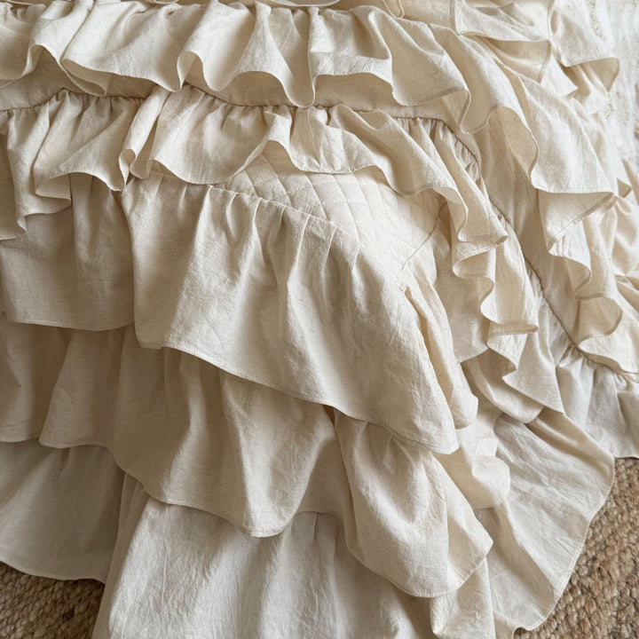 Ruffled bed linen set made of cotton quilt with stitch pattern and pillowcases