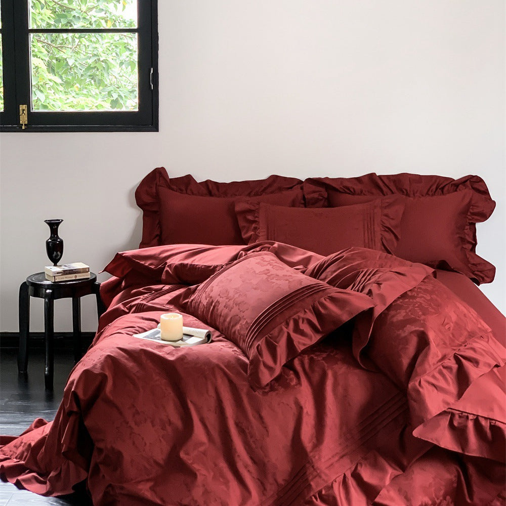 Elegant satin bedding set with ruffles, fine piping and jacquard relief