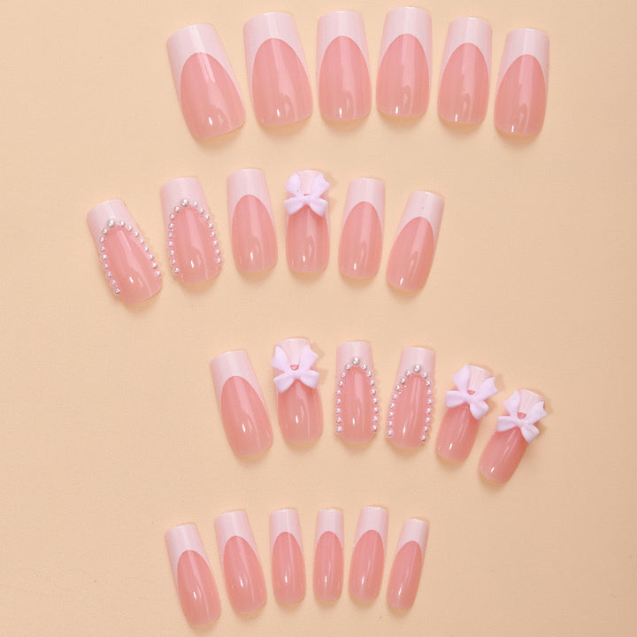 Artificial nails with delicate flower and pearl embellishments Kalsten