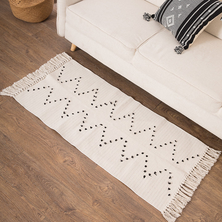 Woven runner rug with fringes and graphic polka dot pattern Kalsten