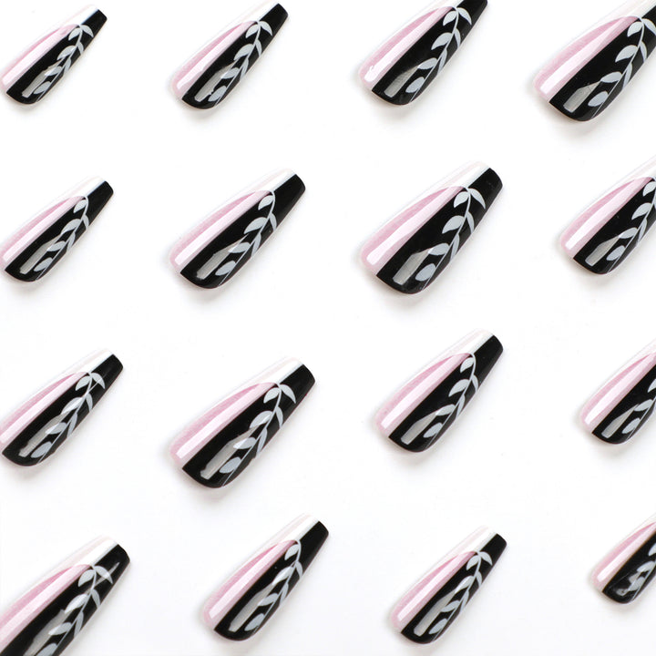 Artful nail extensions in elegant black and white design Kalsten