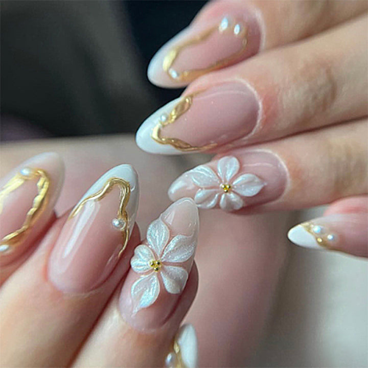 Artificial nail set with elegant gold accents and floral decorations Kalsten
