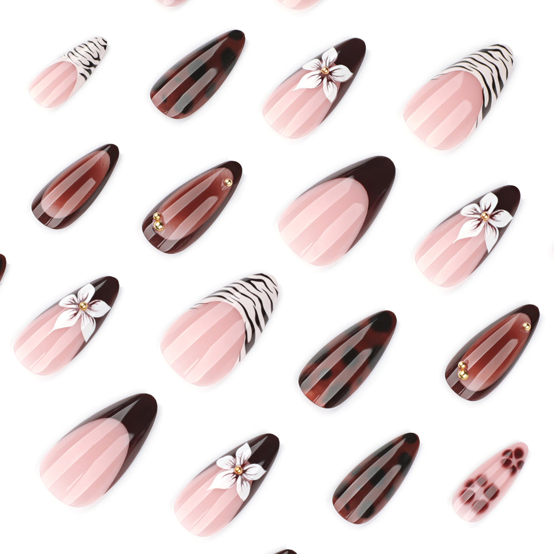 Artistic stiletto nails with elegant floral designs and glitter accents Kalsten