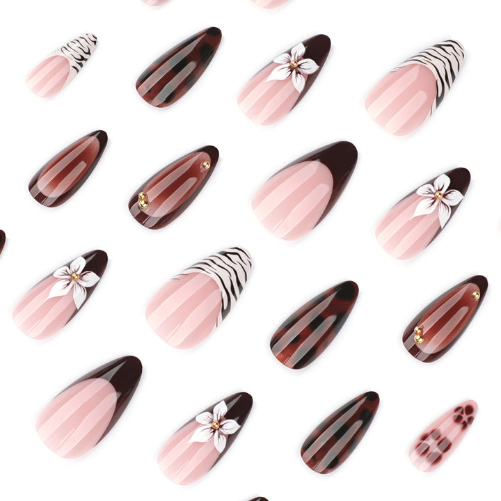 Artistic stiletto nails with elegant floral designs and glitter accents Kalsten