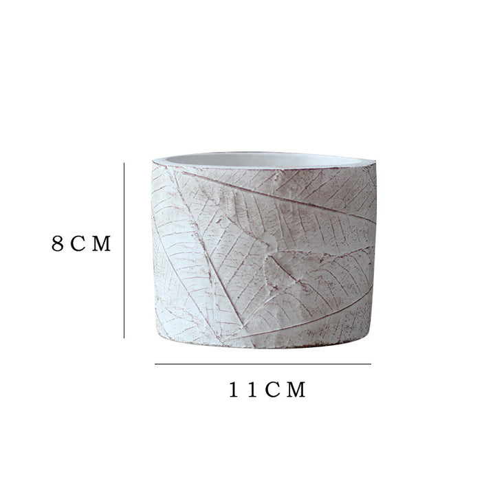Decorative plant container made of handmade ceramic with leaf pattern Kalsten