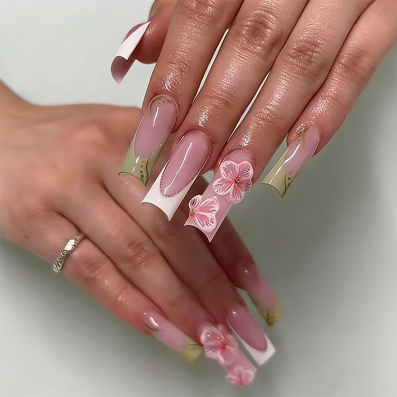 Artful nail tips with floral embellishments Kalsten