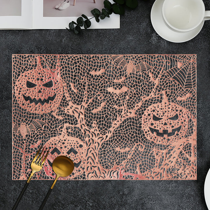 Halloween plastic table mats with intricate pumpkin and spider web design