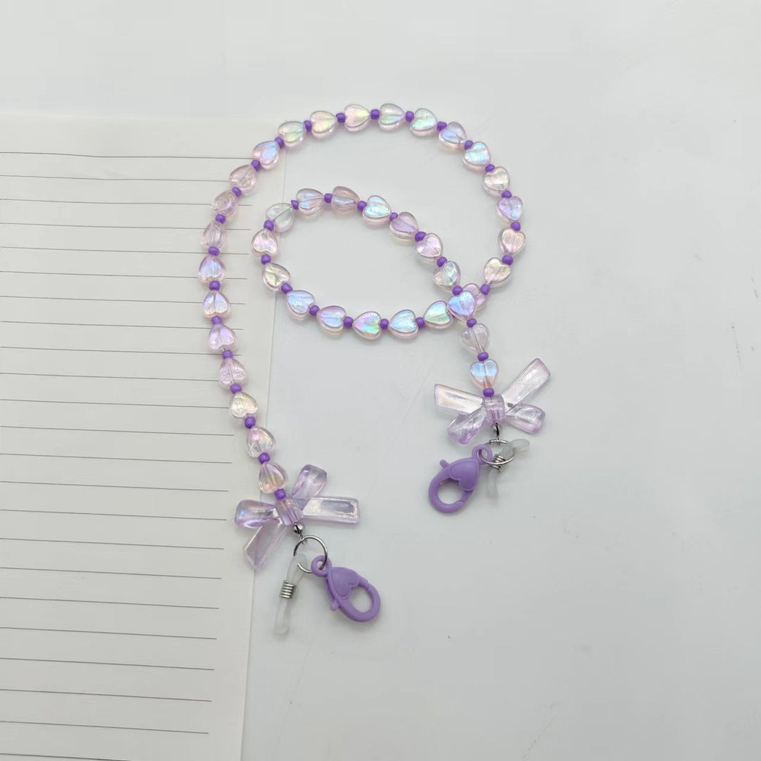 Fashionable glasses holder chain with heart and flower motifs Kalsten