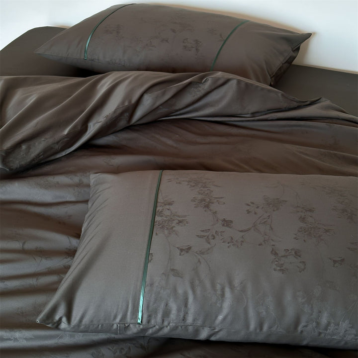 Luxurious satin bedding with floral jacquard and contrast piping