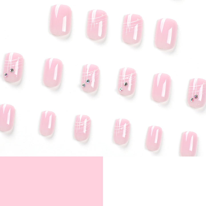 Artful nail extensions with elegant design and rhinestone embellishments Kalsten