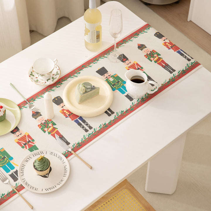 Festive woven table runner with nutcracker motif and golden fringes Kalsten