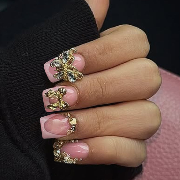 Glamorous artificial nail set with floral accents and glitter decorations Kalsten