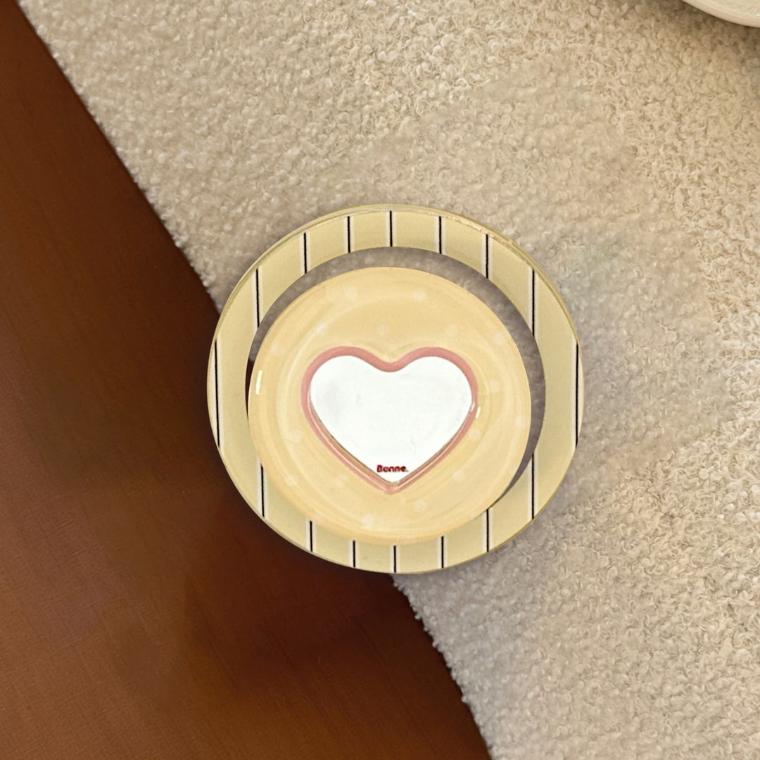 Heart-shaped coaster with playful design Kalsten