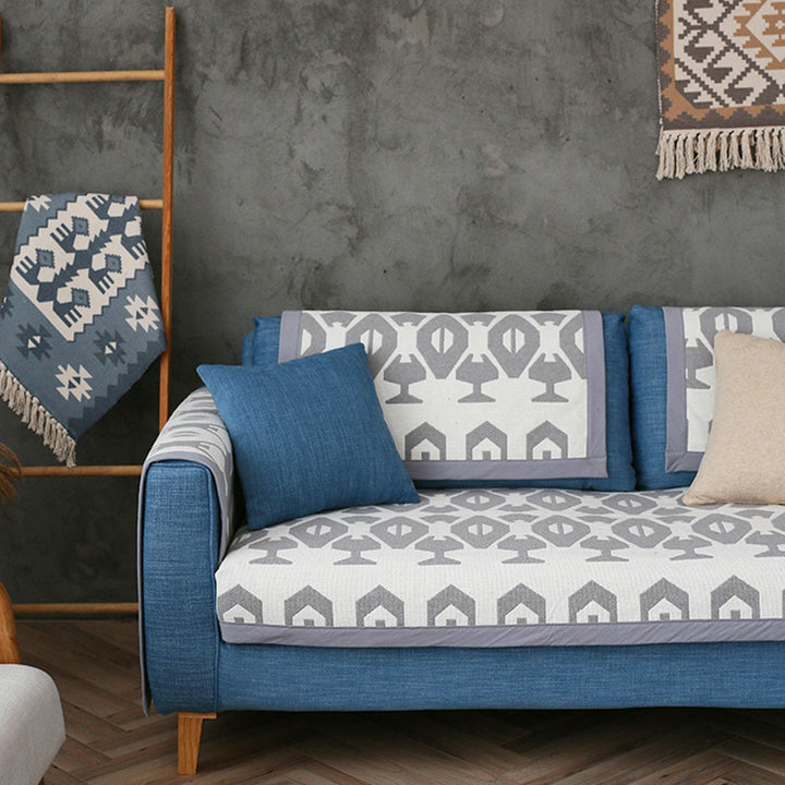 Universal sofa protective cover for three-seater with leaf print, non-slip underside and separate armrest covers Kalsten
