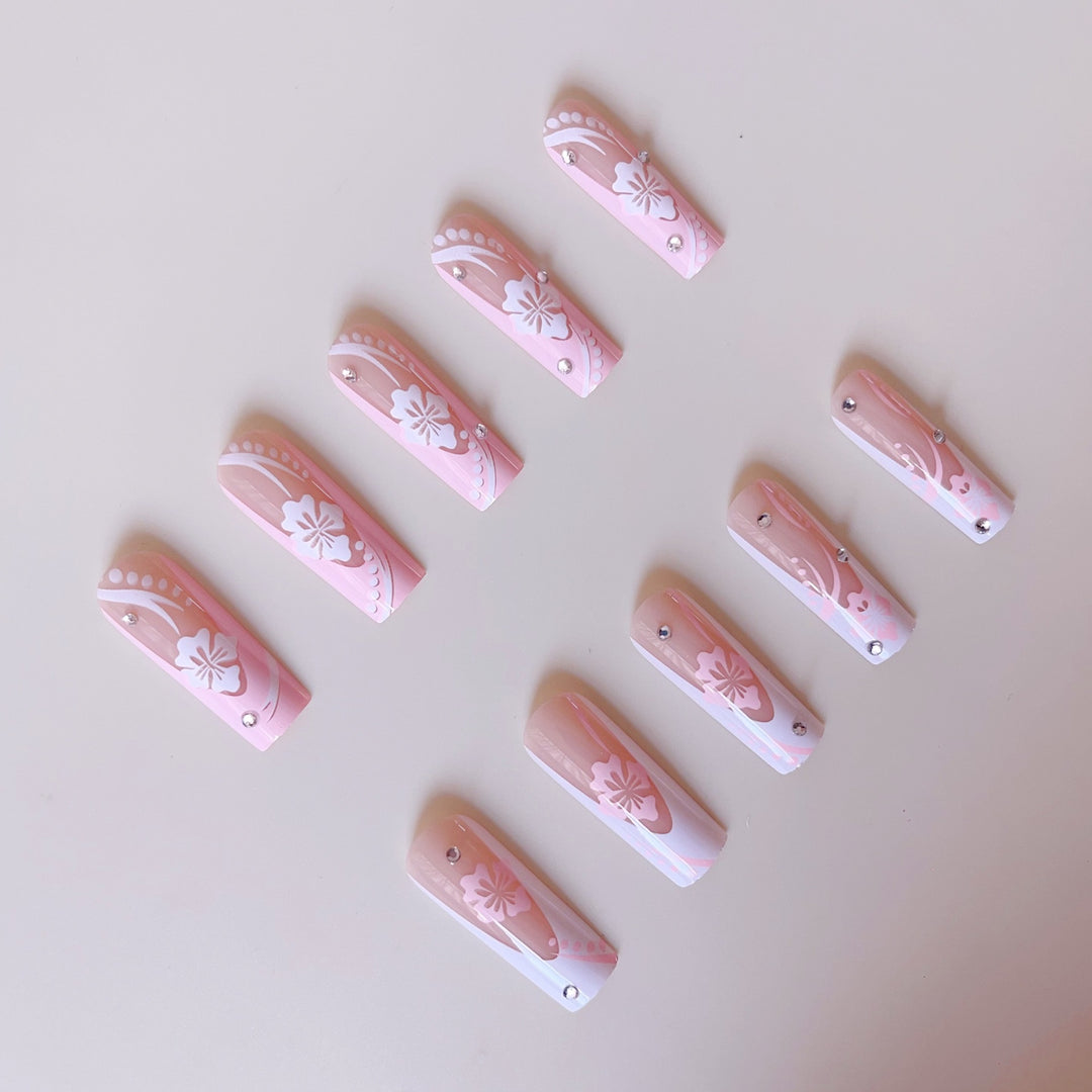 Art nail set with elegant flower design and crystal embellishments Kalsten