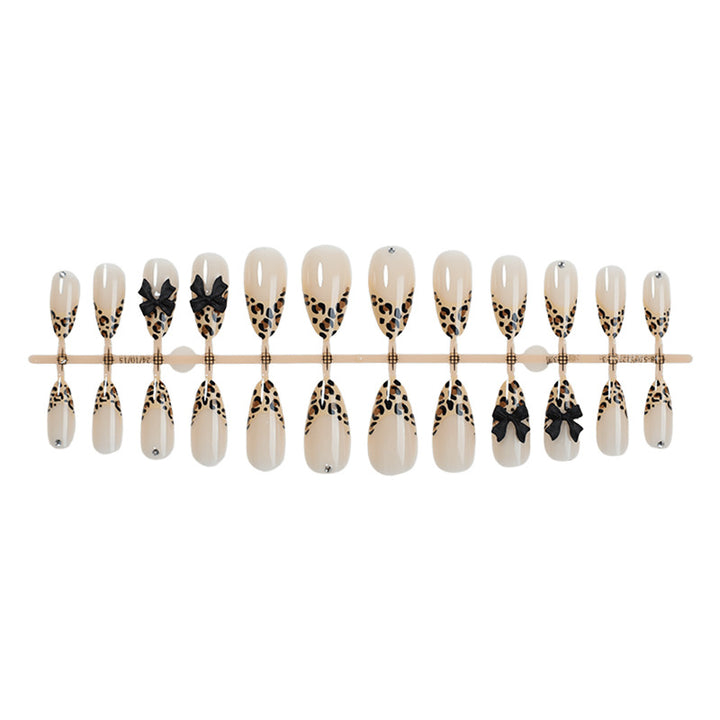 Creative nail set with leopard design and glitter accents Kalsten