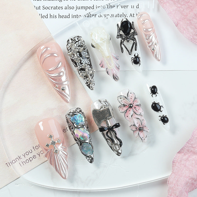 Creative nail art set with Halloween motifs and intricate details Kalsten