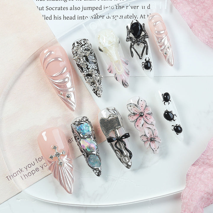 Creative nail art set with Halloween motifs and intricate details Kalsten