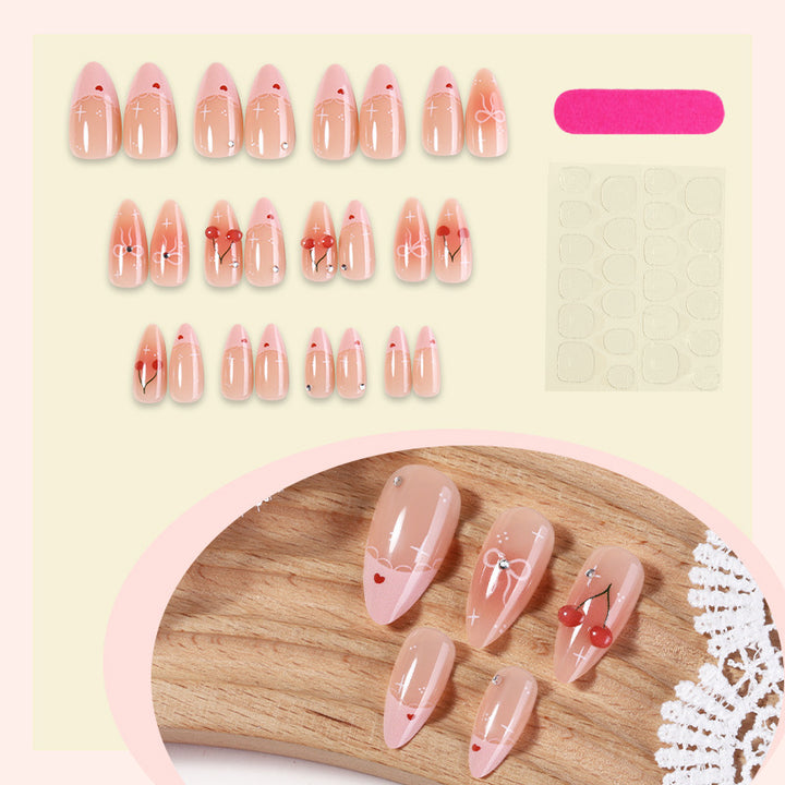 Artifical nails with playful heart and bow designs Kalsten