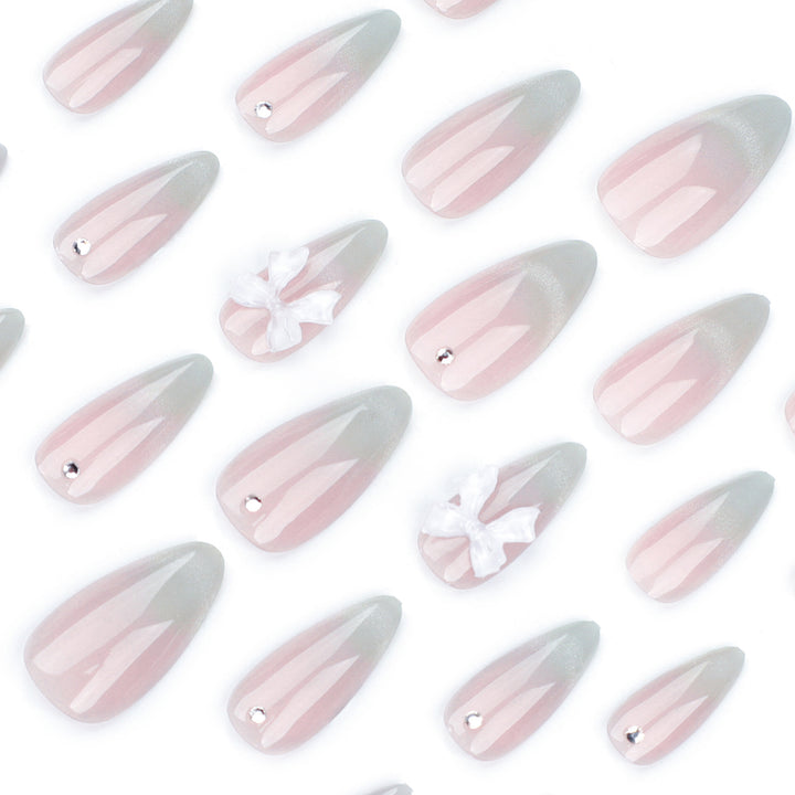 Elegant Stiletto Nails with Glitter and Bow Accents Kalsten