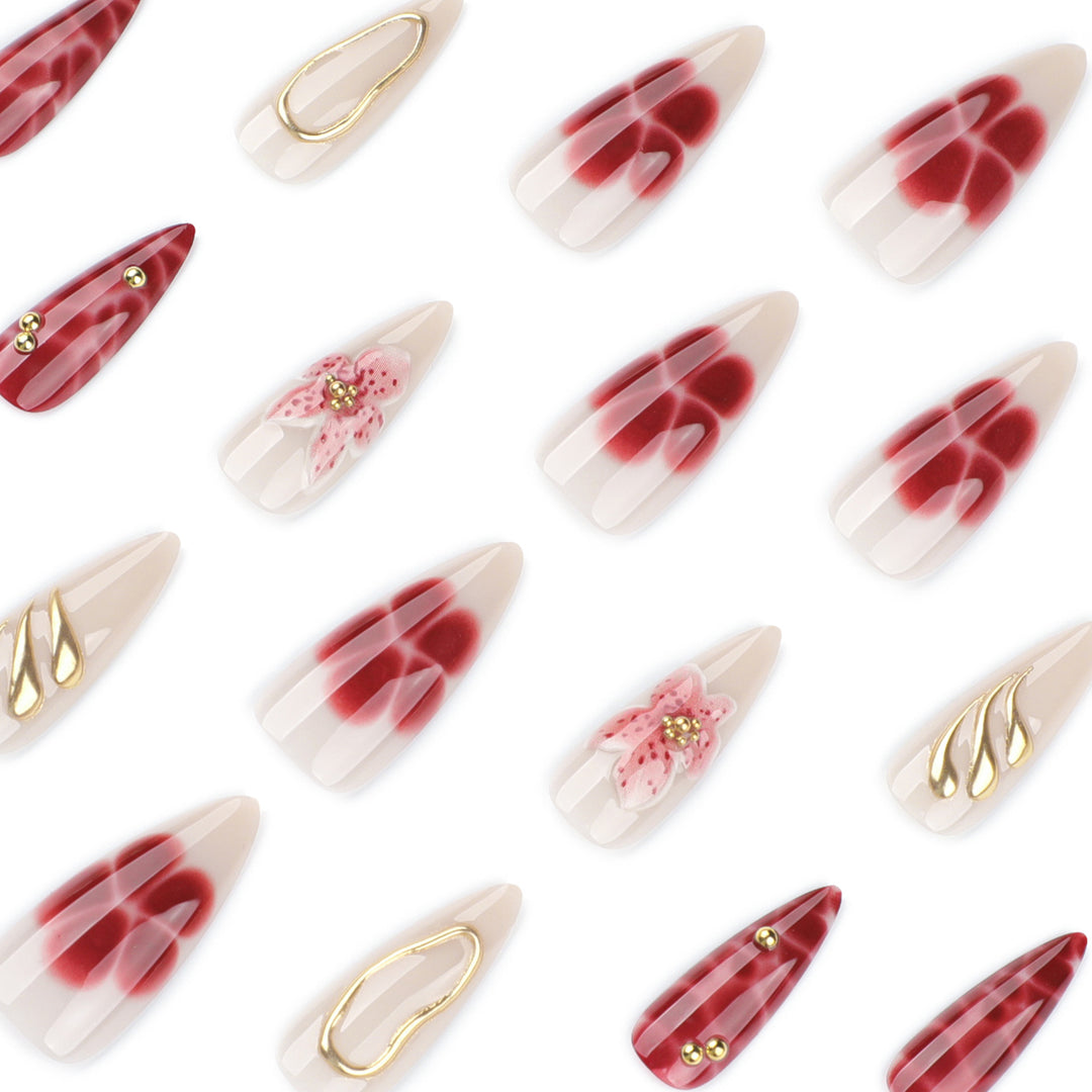 Artful stiletto nails with elegant floral designs and glitter accents Kalsten