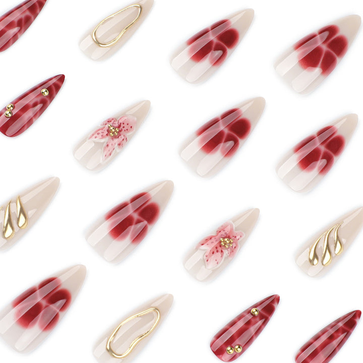 Artful stiletto nails with elegant floral designs and glitter accents Kalsten