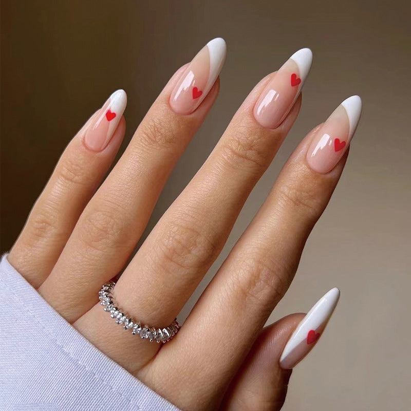 Glamorous nail art with heart decorations Kalsten