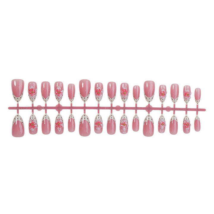 Nail art set with floral designs and glitter accents Kalsten