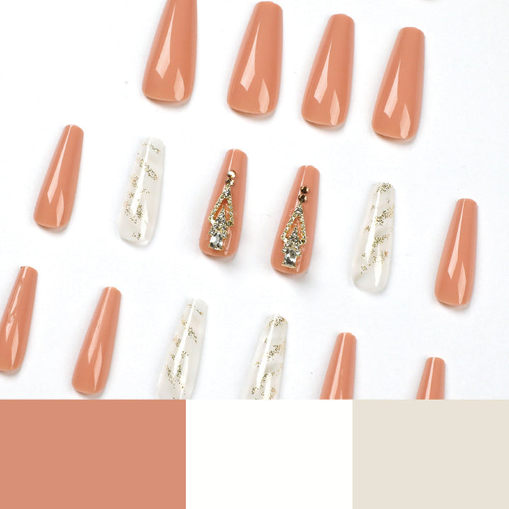 Artful nail extensions with glitter embellishments and delicate accents Kalsten
