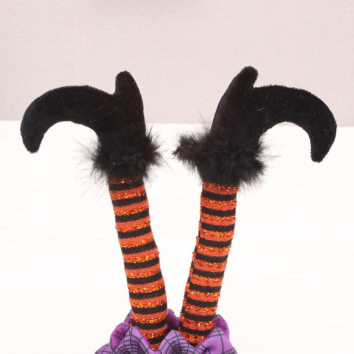 Skurrile Halloween table figure with standing witch legs and spider web sack