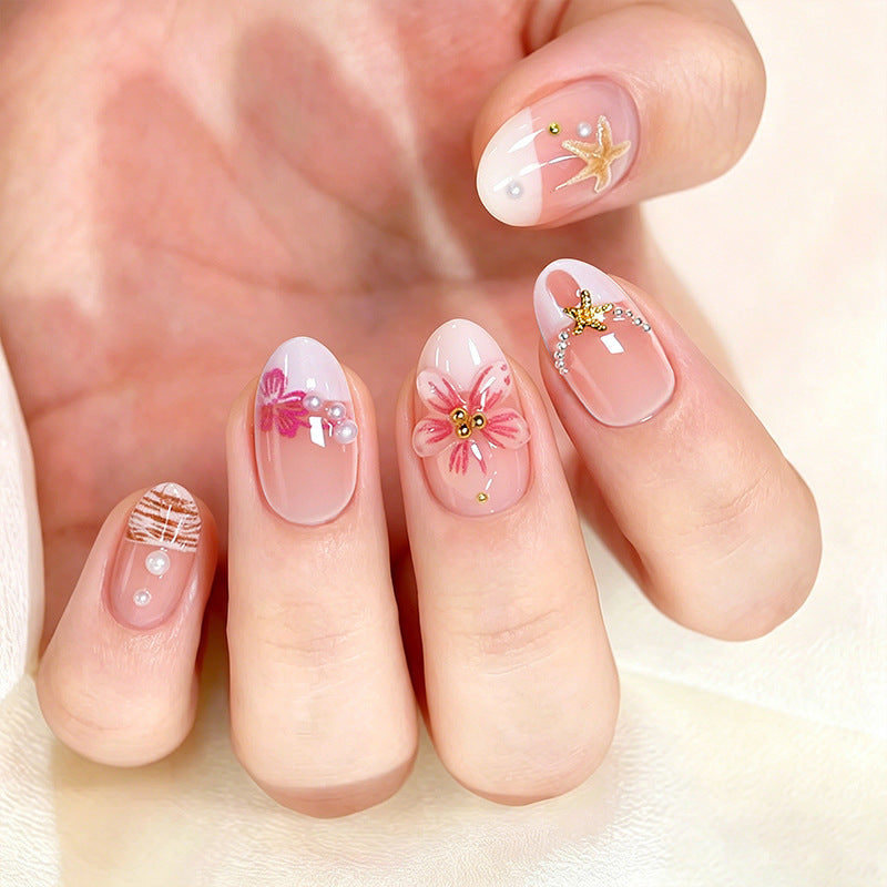 Elegant artificial nails with floral designs and glitter accents Kalsten