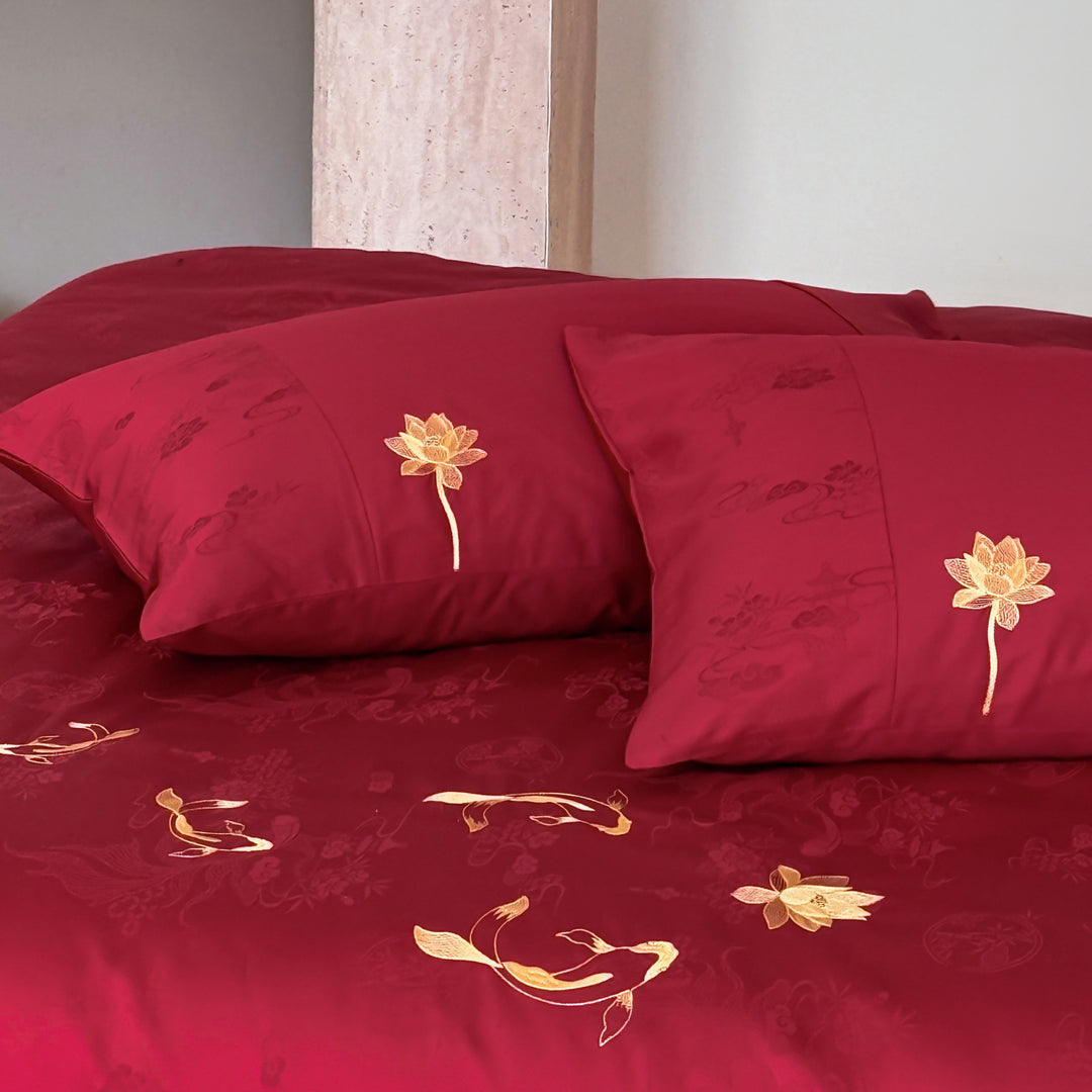 Luxurious bed linen set made of cotton satin with embroidered koi motifs and fine jacquard structure