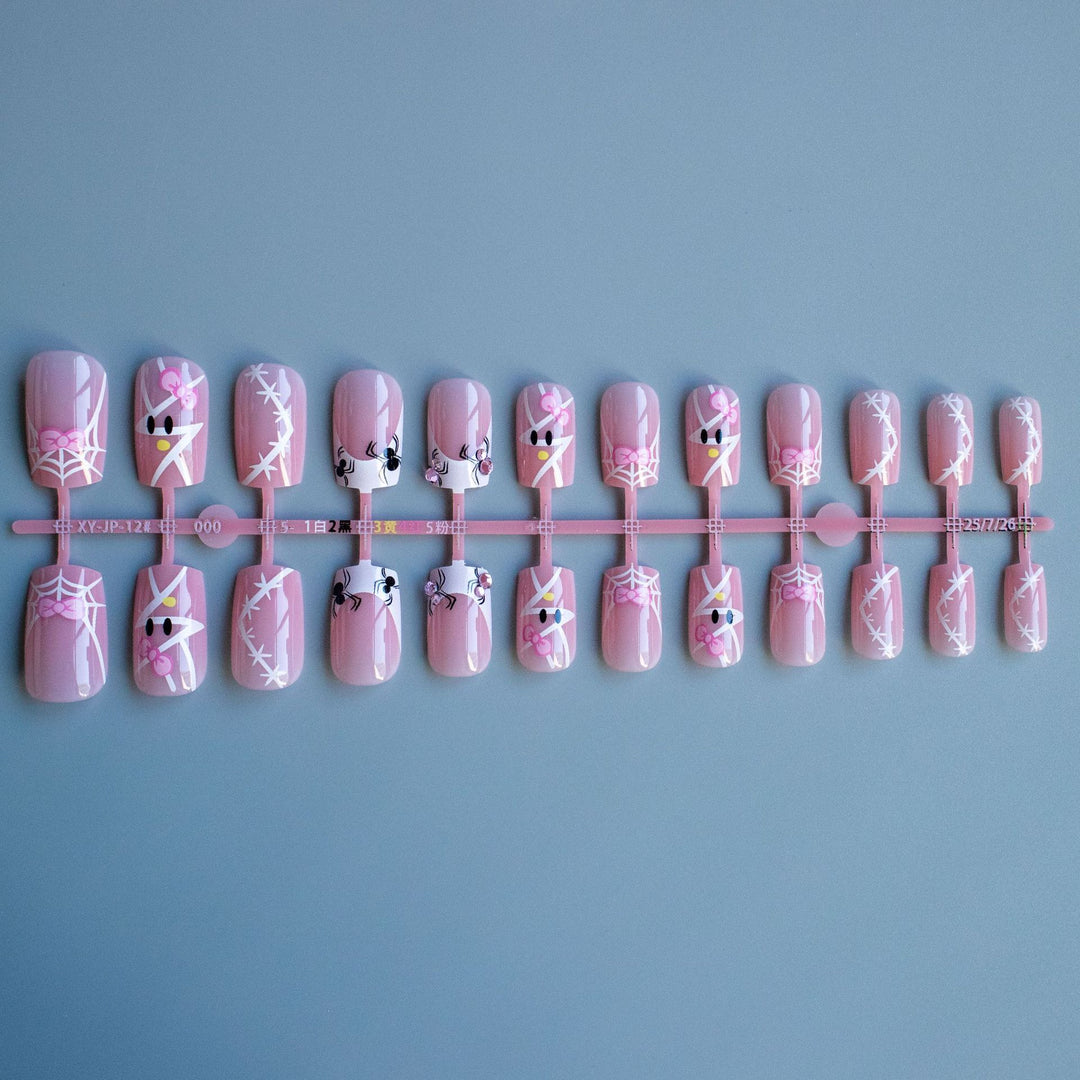 Decorative Nail Art Set with Bow and Spider Web Design