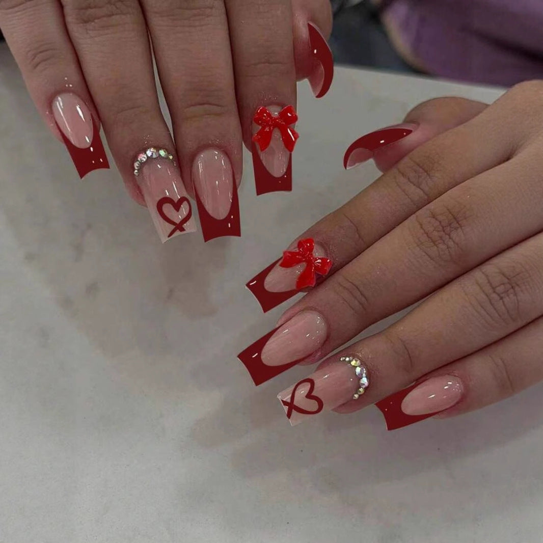 Nail art with heart and bow motifs Kalsten