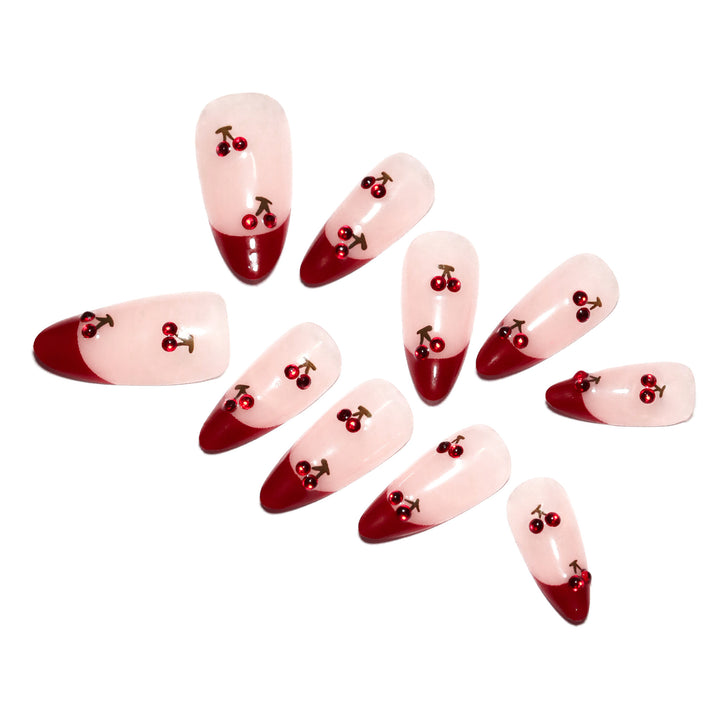 Artful stiletto nails with cherry motifs and glitter accents Kalsten