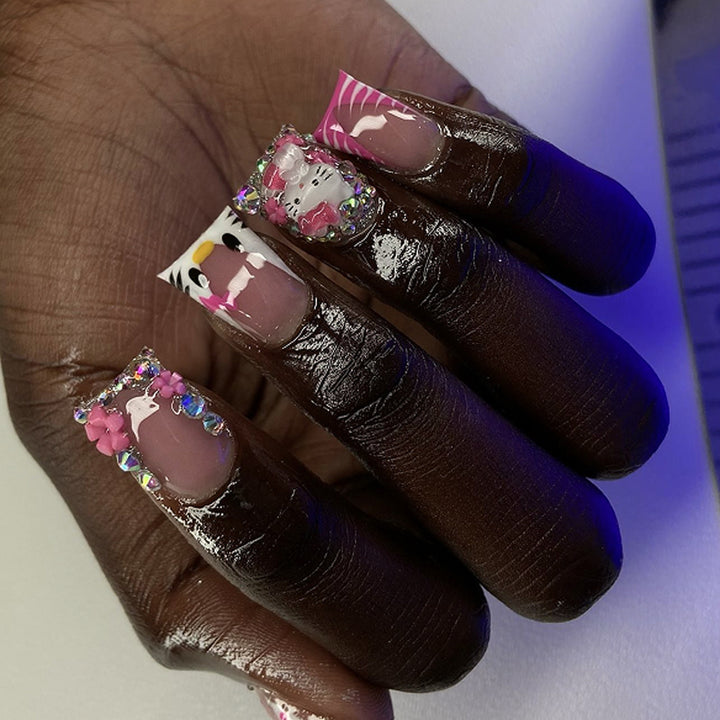 Artistic Nail Art with Animal Motifs and Glitter Accents Kalsten