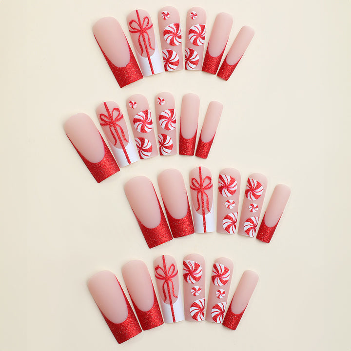 Artificial nail set with festive candy cane design and glitter accents Kalsten