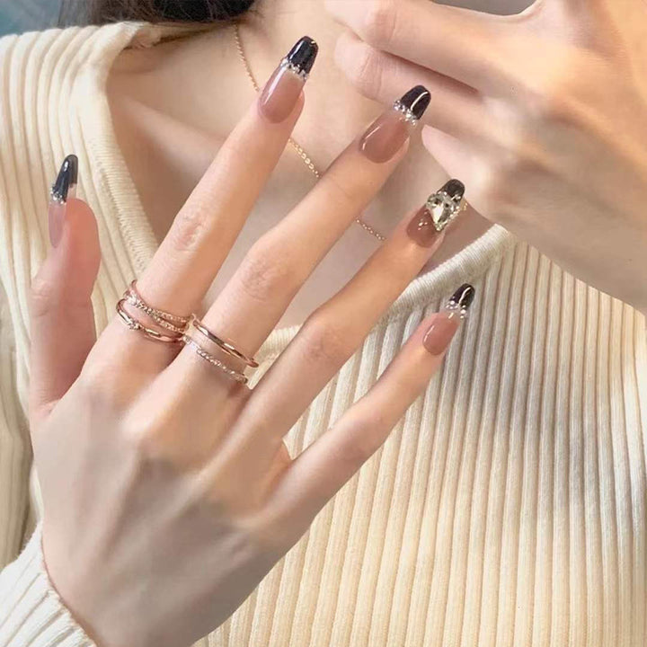 Artificial nails with heart accent and glamorous decorations Kalsten